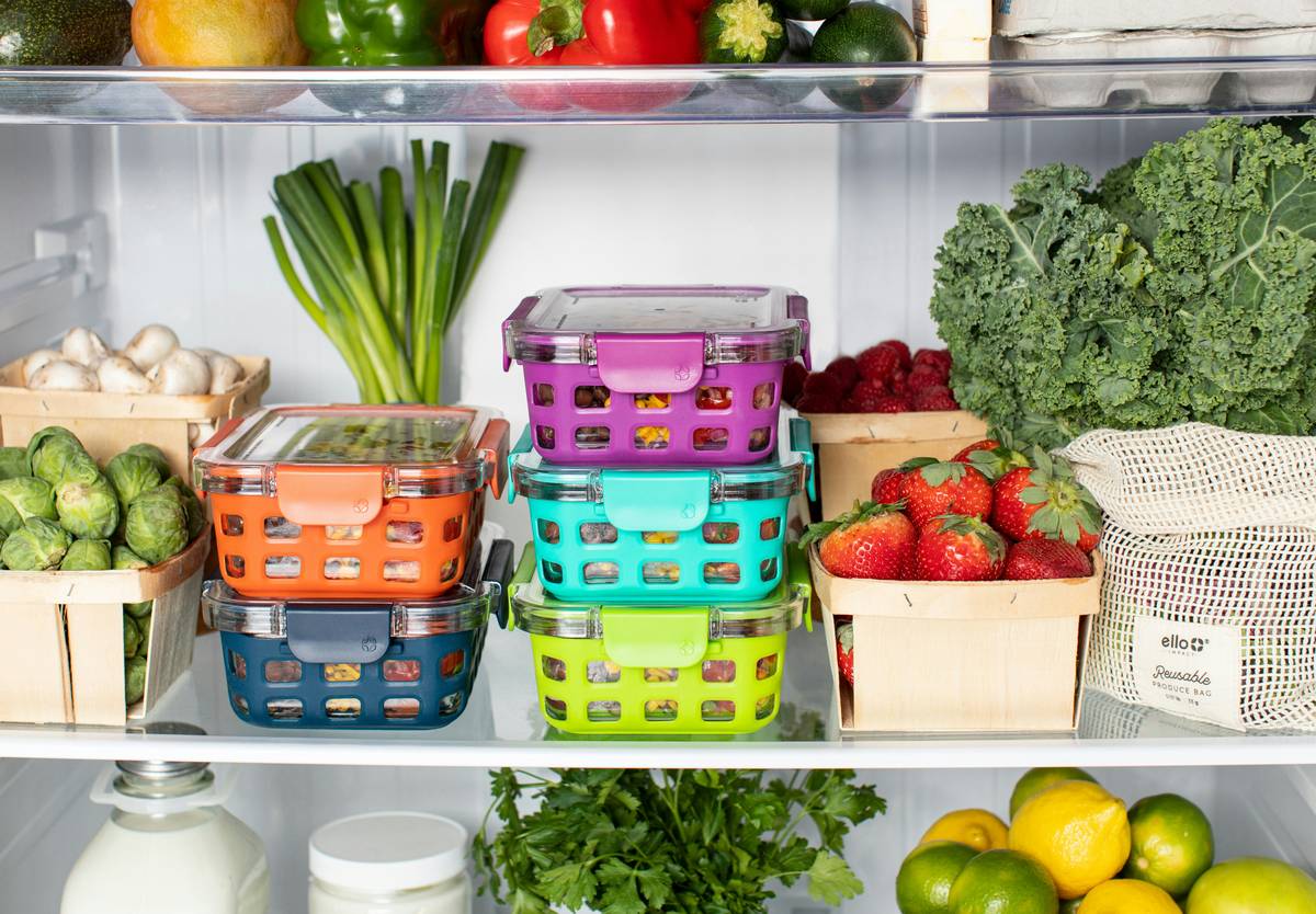 Close-up of reusable silicone food storage bags on a kitchen counter with the question is silicone safe for food storage